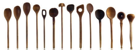 Kitchenware - Old wooden kitchen spoons isolated on a white background panoramaの写真素材