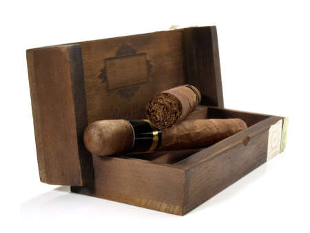 Cigars in a box isolated on white backgroundの写真素材