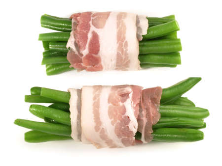 Green beans rolled in bacon on white background - Isolatedの写真素材