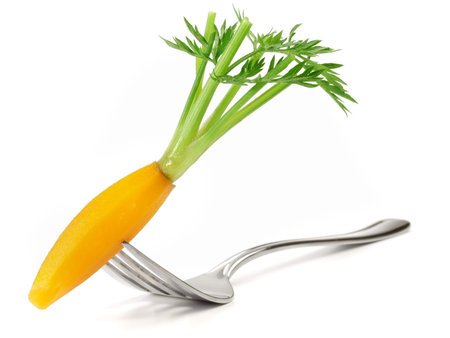 Boiled shaped Carrot on a Fork - White Background - Isolatedの写真素材