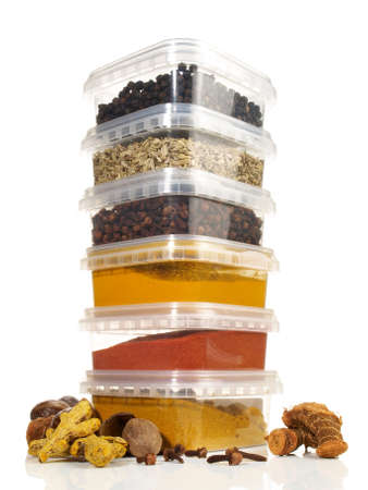 Various Spice in Plastic Boxes on white Background - Isolatedの写真素材