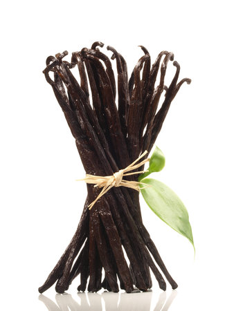 Vanilla Bean Bundle with Vanilla Leaves on white background - Isolatedの写真素材