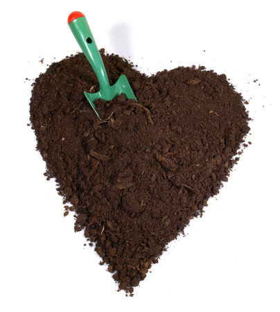 Soil Heart with Garden Shovel isolated on white background, Love Gardening.の写真素材