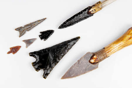 Stone Age Tools on white background - Stone Age Knives and Obsidian Arrowsの写真素材