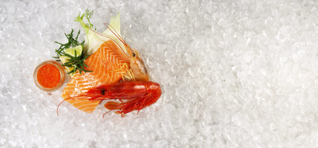 Raw Salmon Fillet Steak with Tiger Prawns, Gamba Carabinero and Shrimp on Ice with white Background