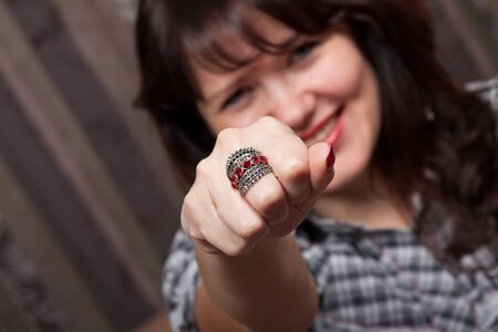 Pretty smiling girl witj a metal ringの写真素材