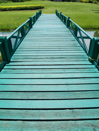 Green wooden bridge in Buddhamonthon, Nakhon Pathom, Thailandの写真素材