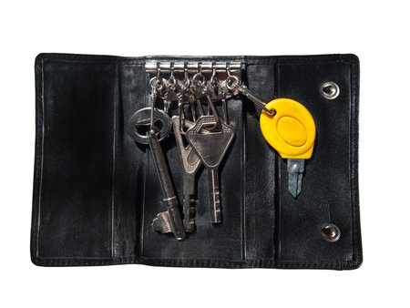 Isolated black leather case for keys  on white backgroundの写真素材