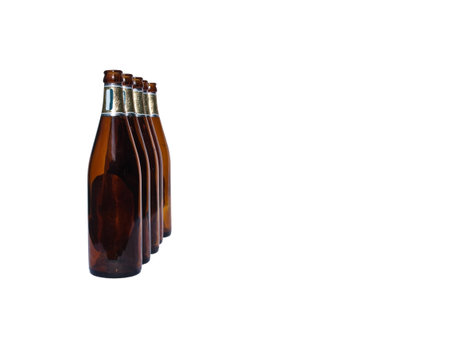 Empty beer bottles isolated over white backgroundの写真素材