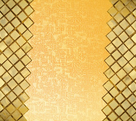 Golden mosaic wall  with chinese letters in open areaの写真素材