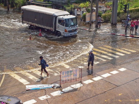 Phetkasem Road, Bangkok, Thailand - November 3 : Heavy flooding from monsoon rain in center of Thailand arriving in Bangkok suburbs on November 3, 2011 in Phetkasem Road, Bangkok, Thailand. のeditorial素材