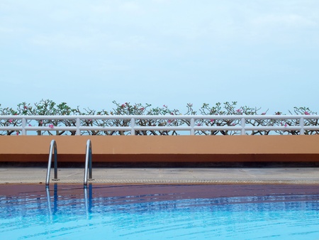 Swimming pool with blue water on terrace of condominiumの写真素材