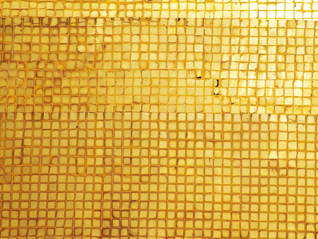 Abstract golden grunge mosaic with highlight textureの写真素材
