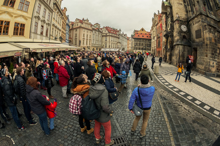 PRAGUE, CZECH REPUBLIC - FEBRUARY 19TH, 2014 -Tourists watch astronomical clock in actionのeditorial素材