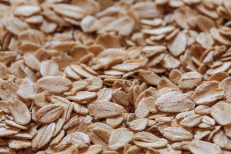 oatmeal grains photo, oat flakes, rolled oats, oat background. oatmeal photo, dry oatmealの写真素材