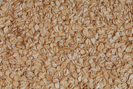 oat flakes photo, rolled oats, oat background. oatmeal photo, dry oatmeal, oatmeal grainsの写真素材