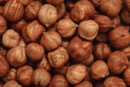 peeled hazelnuts, hazelnut background, natural nuts, vegetarian food, hazelnuts without shellの写真素材