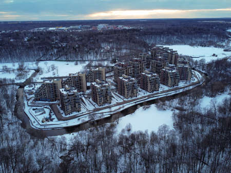 Aerial view of residental complex Novogorsk Olympic village in the evening at sunset. River like a border, beautiful view from the sky.の写真素材