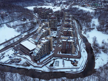 Aerial view of residental complex Novogorsk Olympic village in the evening at sunset. River like a border, beautiful view from the sky.の写真素材