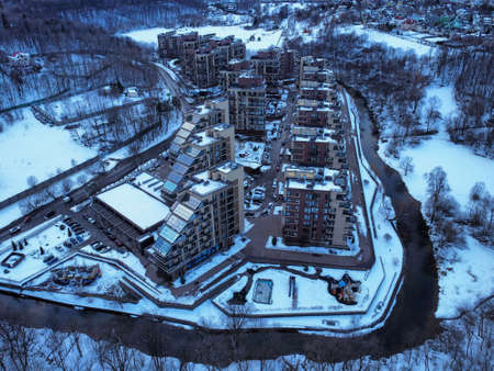 Aerial view of residental complex Novogorsk Olympic village in the evening at sunset. River like a border, beautiful view from the sky.の写真素材