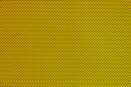 Yellow background texture with round holesの写真素材