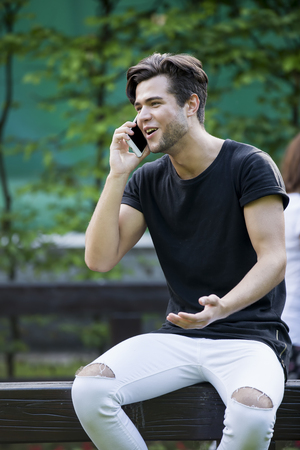 handsome happy man talking on the phone.の写真素材