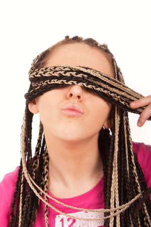 Girl hiding behind her hairの写真素材