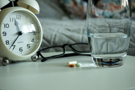 Soft Light Highlights Essential Morning Medicine On Bedside Table