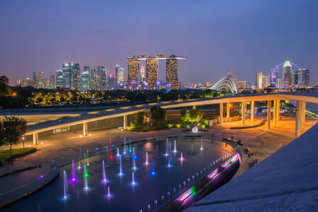 Panorama of Singapore skyline illuminated in the evening twilightのeditorial素材