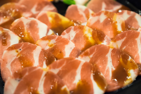 Fresh raw uncooked  pork sliced with sauce