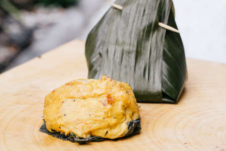 steamed fish with curry paste on woodの写真素材