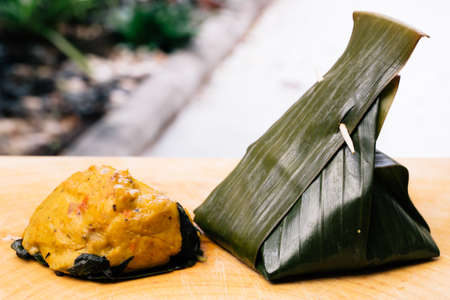steamed fish with curry paste on woodの写真素材
