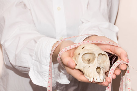 Weight loss pills, waist and skull on women hand .suicide pills, drug can kill you  women holding waist skull and pillsの写真素材