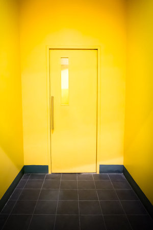 Closed yellow  Door on Yellow Wall