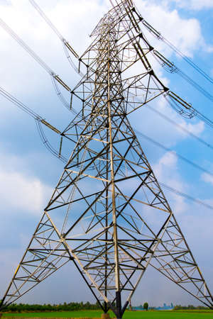 electric high voltage power post with blue skyの写真素材
