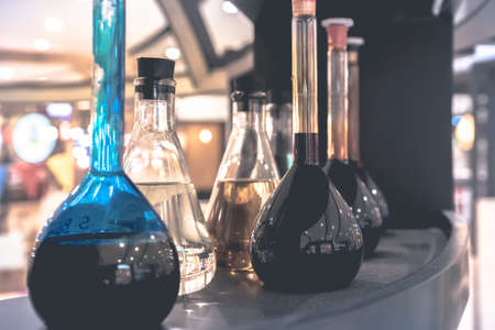 Pharmacy and chemistry theme. Test glass flask with solution in research laboratory. Shallow DOF. fade filterの写真素材