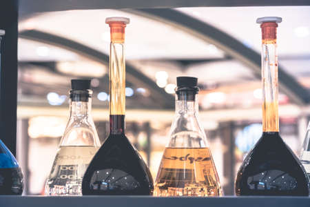 Pharmacy and chemistry theme. Test glass flask with solution in research laboratory. Shallow DOF. fade filterの写真素材