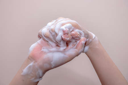 Women washing of hands with soap foam ,nice soft backgroundの写真素材