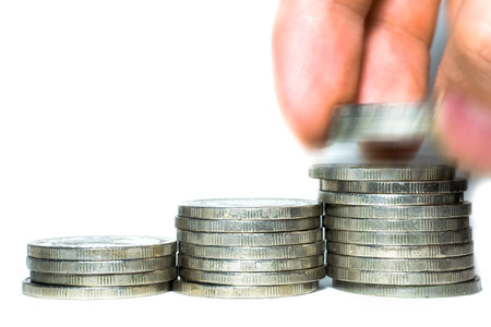 Hand human hand putting coin to money, business ideas isolate on white backgroung
