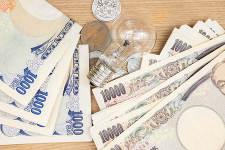Concept of currency Japanese Yen and lamp for money ideaの写真素材