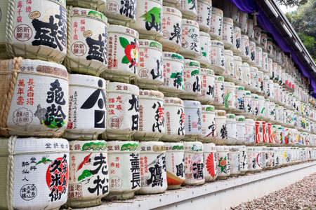 TOKYO - MARCH 5, 2016: Close up of multiple stacked Sake barrels in front of Meji Jingu shrineのeditorial素材