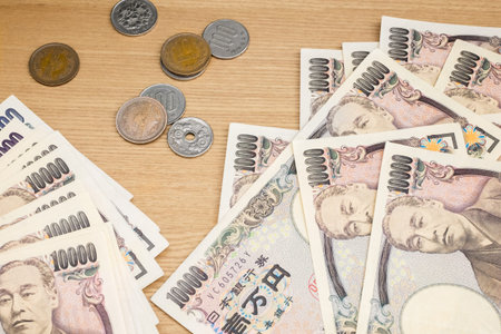 Japanese Yen on wood background