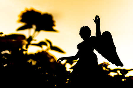 Angle Sculpture silhouette with sunset backgroundの写真素材