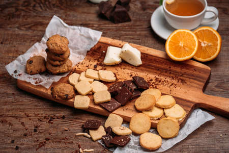 Closeup of a group of assorted cookies. Chocolate chip, oatmeal raisin, white chocolate fill the frame.の写真素材