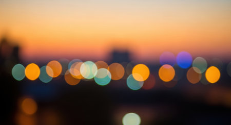 Abstract blurred city lights at sunset create a warm and inviting bokeh background for various creative projectsの素材