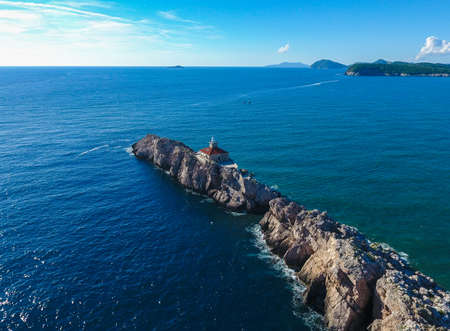 Lighthouse on the rocksの写真素材
