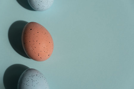 Easter eggs on a blue background, Easter card with copy space for text