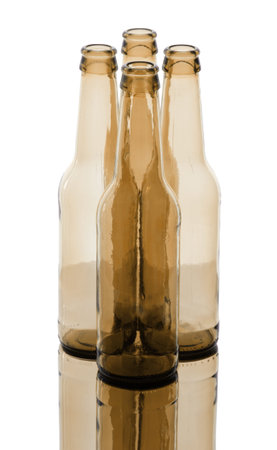 Bunch of empty glass beer bottles with back lighting.の写真素材
