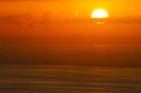 Sunrise glow of oceanの写真素材