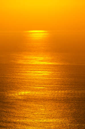 Sunrise glow of oceanの写真素材